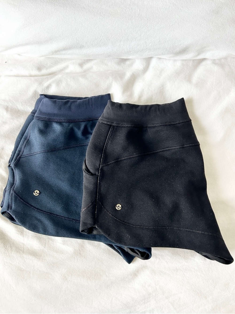 2 pairs- lululemon athletica Navy Blue and Black Fleece Shorts